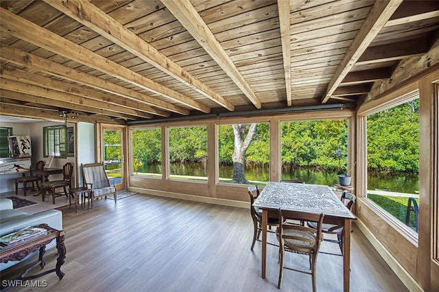 sunroom with beamed ceiling and wooden ceiling