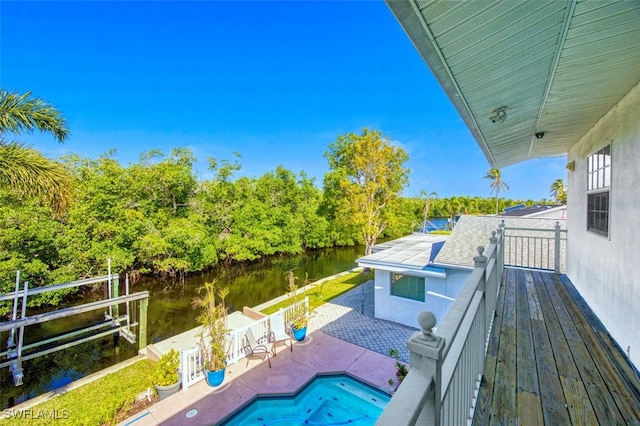 balcony with a patio and a water view