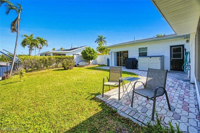 view of yard featuring a patio and fence