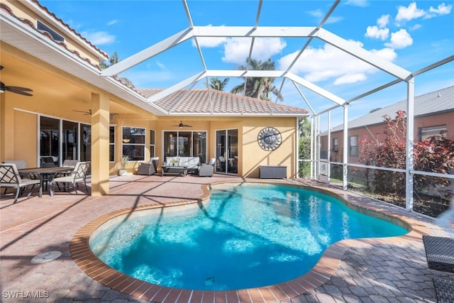 outdoor pool with a patio area, an outdoor living space, a lanai, and ceiling fan