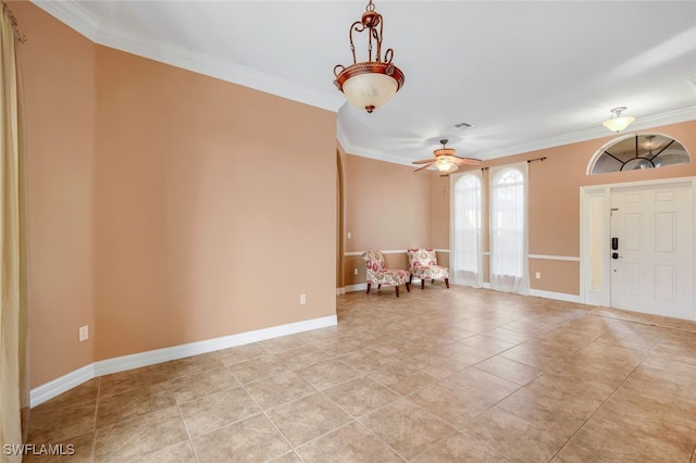 foyer with light tile patterned floors, baseboards, ornamental molding, and ceiling fan