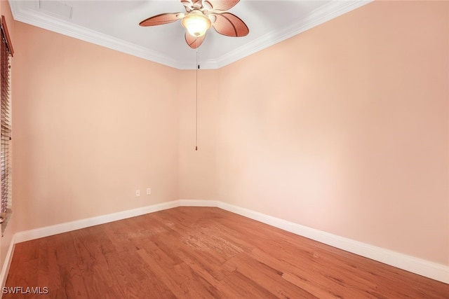 unfurnished room featuring ornamental molding, baseboards, a ceiling fan, and wood finished floors