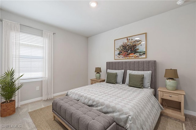 carpeted bedroom with baseboards