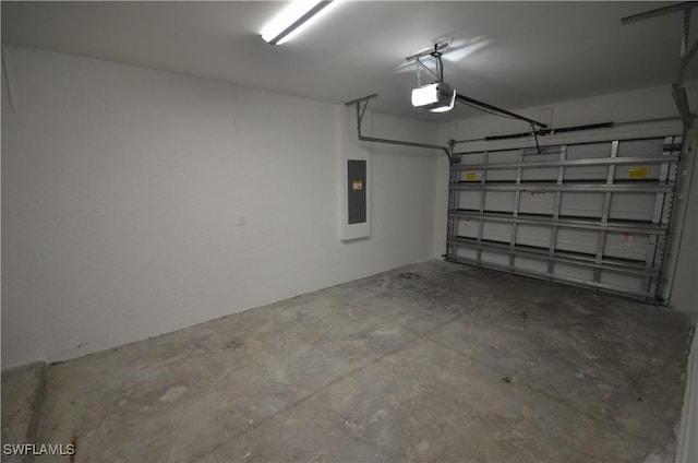 garage featuring electric panel and a garage door opener