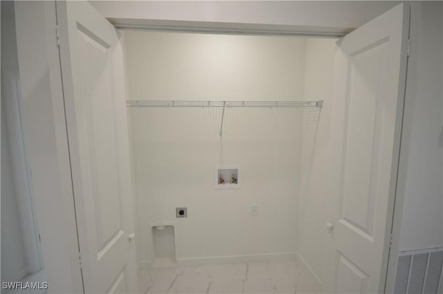 clothes washing area with baseboards, laundry area, hookup for a washing machine, marble finish floor, and electric dryer hookup