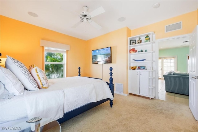 bedroom featuring multiple windows, carpet, and visible vents