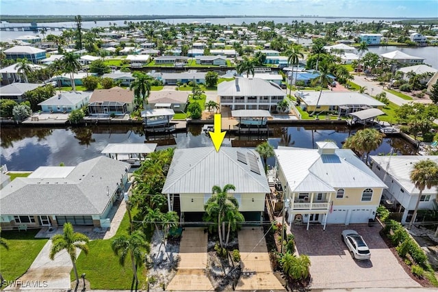 aerial view featuring a residential view and a water view