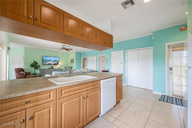 kitchen with light tile patterned floors, visible vents, ceiling fan, a sink, and dishwasher