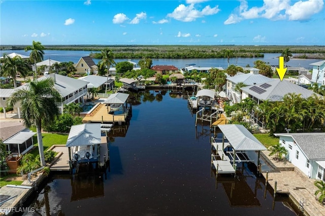 bird's eye view with a residential view and a water view