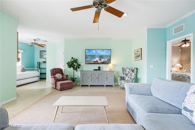 living room with light tile patterned floors, baseboards, visible vents, and ornamental molding