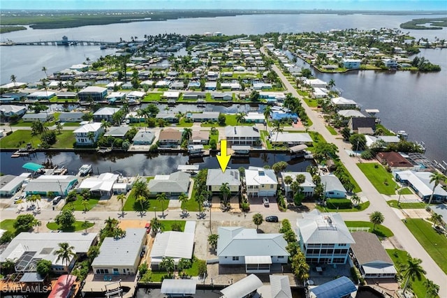 bird's eye view featuring a residential view and a water view