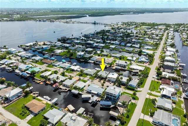 bird's eye view with a residential view and a water view