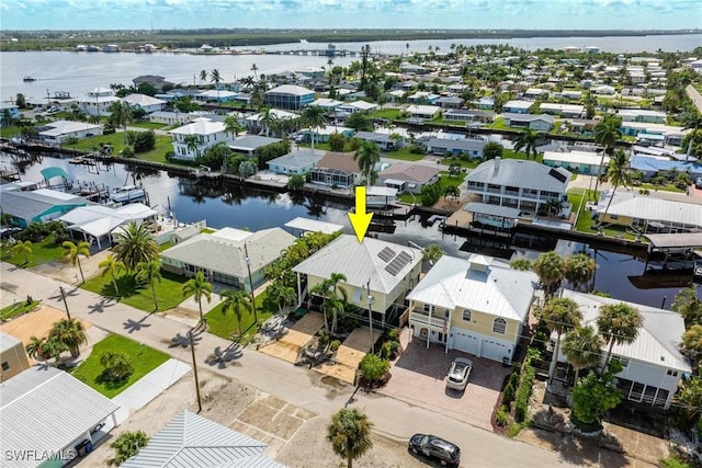 birds eye view of property featuring a residential view and a water view