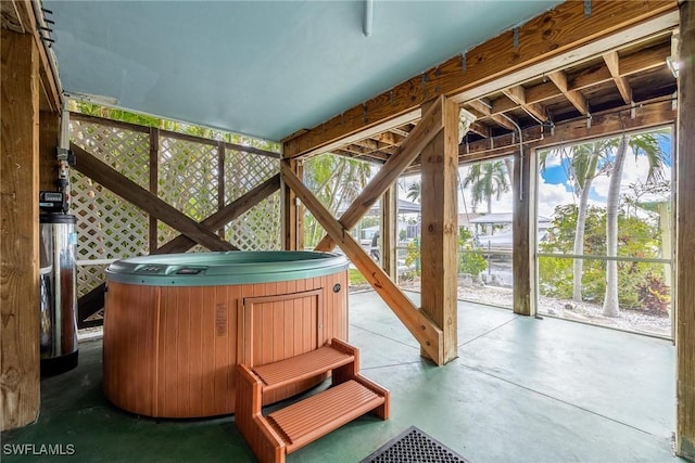 sunroom with a hot tub