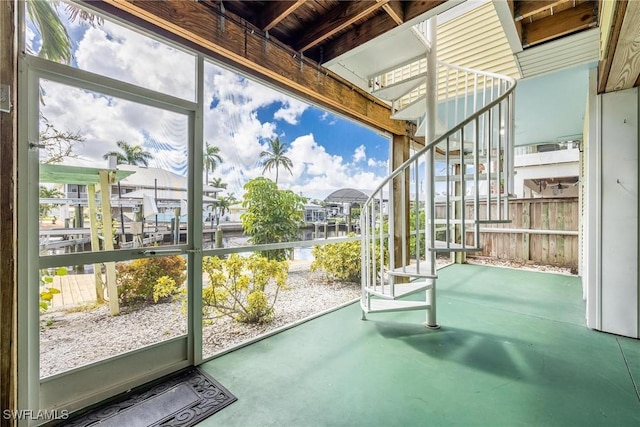 unfurnished sunroom featuring a healthy amount of sunlight