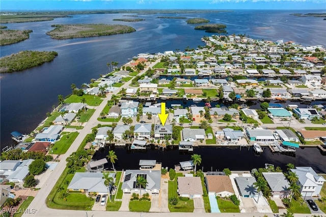 birds eye view of property featuring a residential view and a water view