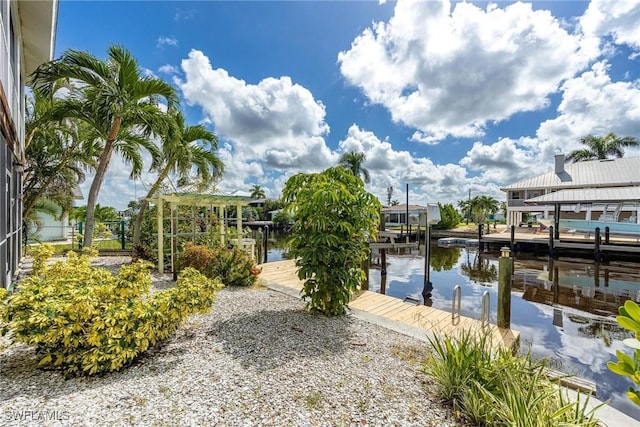 view of dock featuring a water view and boat lift