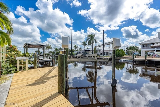 view of dock with a water view and boat lift