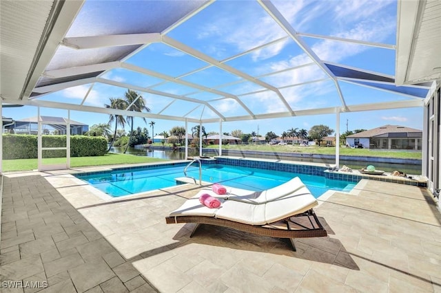 pool featuring glass enclosure and a patio