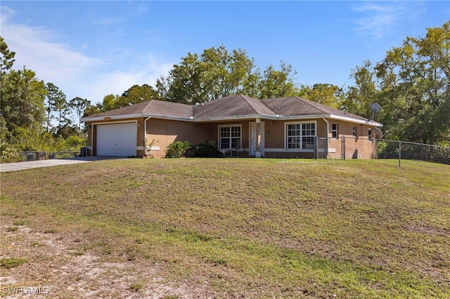 ranch-style house featuring stucco siding, driveway, a front lawn, and fence