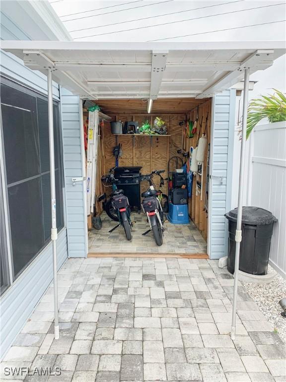 garage with fence