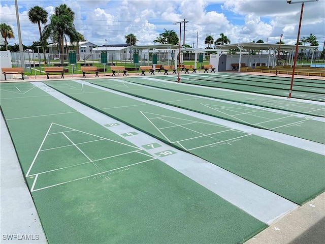 surrounding community with shuffleboard and fence