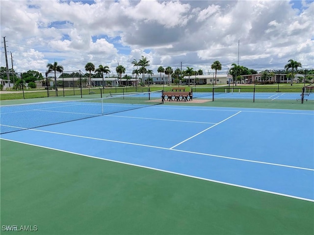 view of tennis court with fence