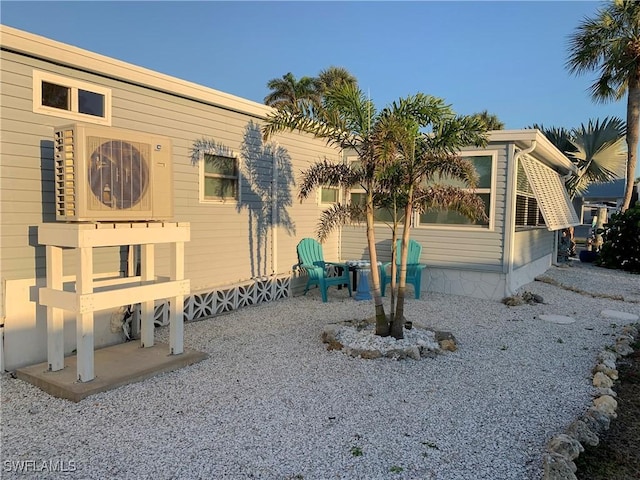 view of home's exterior with ac unit