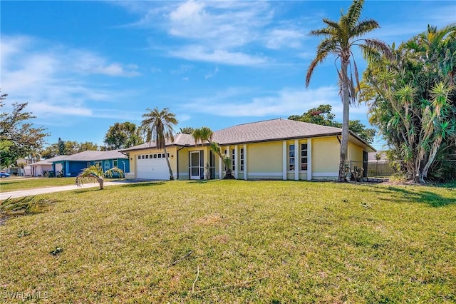 ranch-style home featuring stucco siding, an attached garage, concrete driveway, and a front lawn