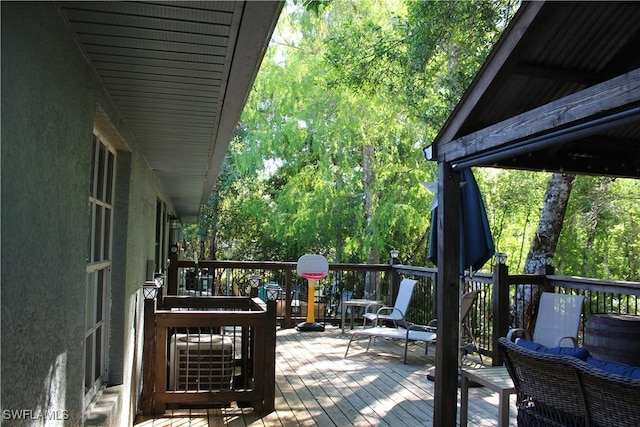 deck featuring a wooded view