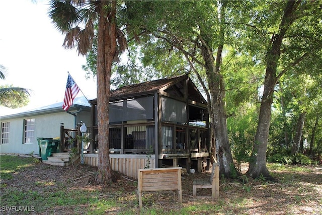 rear view of property with a deck