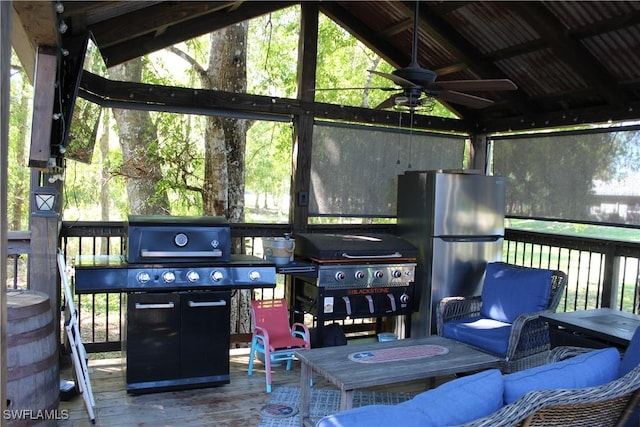 exterior space featuring outdoor lounge area, a grill, and a ceiling fan