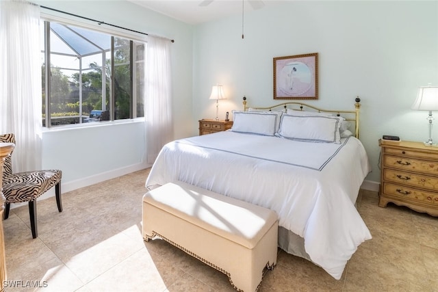 bedroom with light tile patterned flooring and baseboards