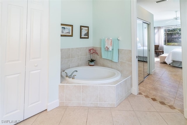 full bath featuring visible vents, tile patterned flooring, a closet, a garden tub, and connected bathroom