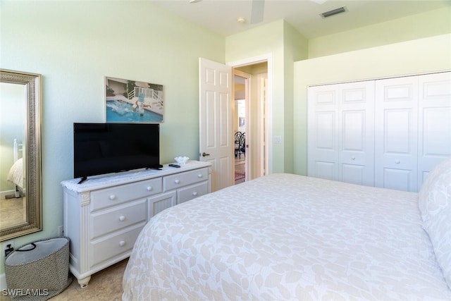 bedroom featuring visible vents and a closet