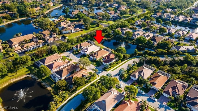 aerial view featuring a residential view and a water view