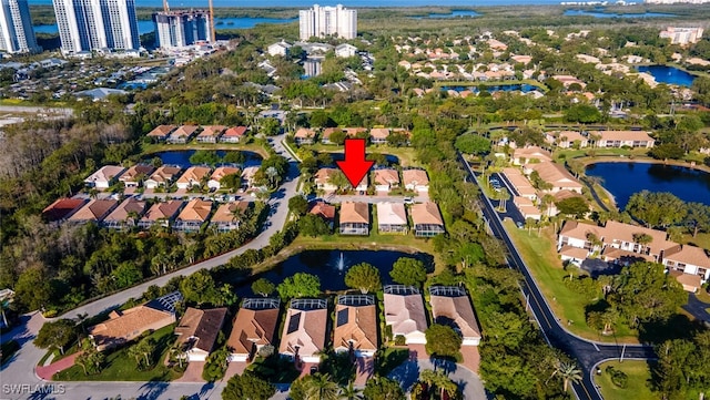 bird's eye view with a residential view and a water view