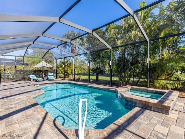 view of pool featuring glass enclosure, a patio, and a pool with connected hot tub