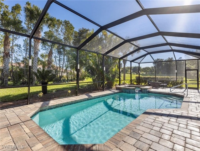 view of pool featuring a pool with connected hot tub, a lanai, and a patio area