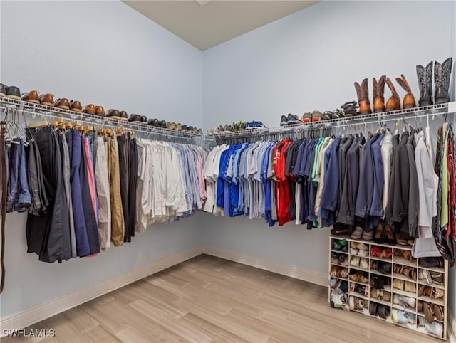 spacious closet with wood finished floors