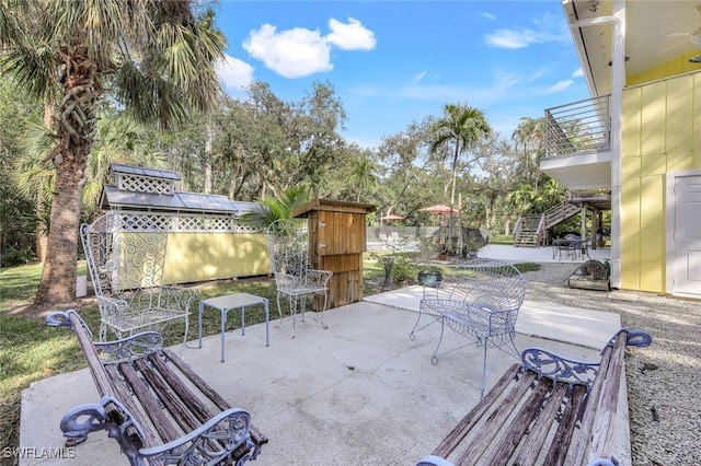 3643 N Rd, Naples, FL 34104 - view of patio / terrace featuring stairs and outdoor dining space
