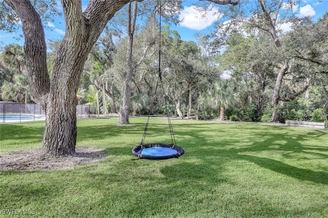 3643 N Rd, Naples, FL 34104 - view of yard featuring fence and a fenced in pool