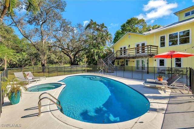 3643 N Rd, Naples, FL 34104 - view of pool with stairway, french doors, fence, a hot tub, and a patio