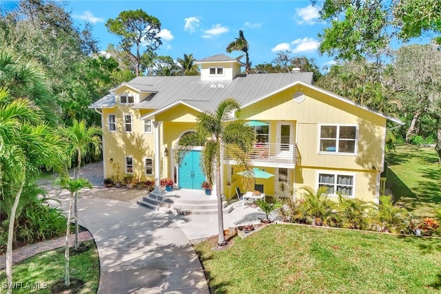 3643 N Rd, Naples, FL 34104 - view of front of home featuring a front yard and stucco siding