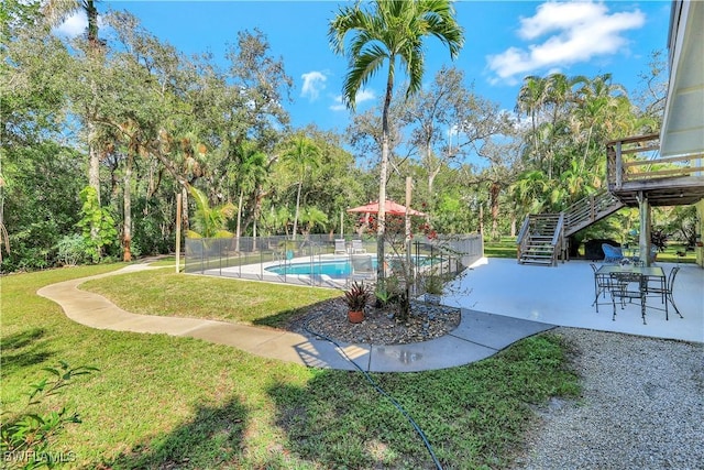 3643 N Rd, Naples, FL 34104 - view of swimming pool featuring a patio, a fenced in pool, a yard, and stairs