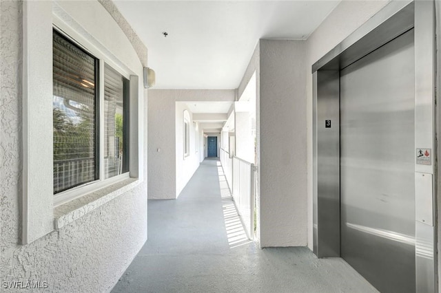 7831 Regal Heron Cir Unit 304, Naples, FL 34104 - hallway featuring elevator