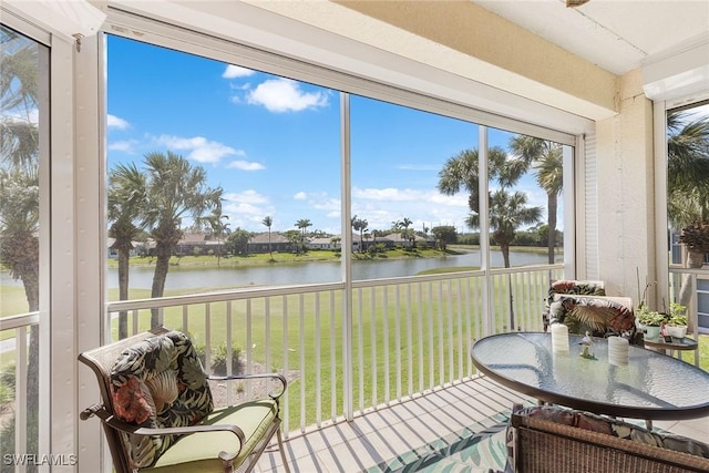 sunroom with a water view