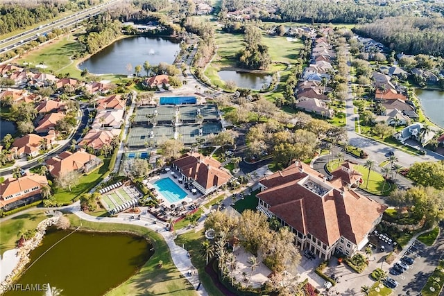 aerial view with a residential view and a water view