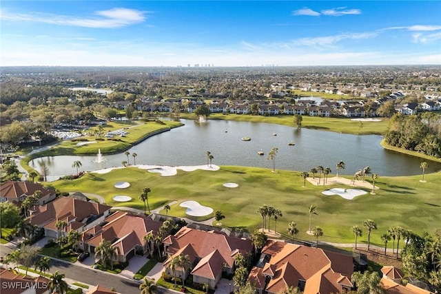 aerial view featuring golf course view, a residential view, and a water view