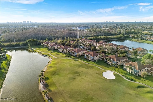 aerial view featuring golf course view and a water view